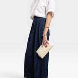 JONES + CO Manuela Classic Clutch in milk white pebbled leather with vintage clasp. Holds a phone and wallet.