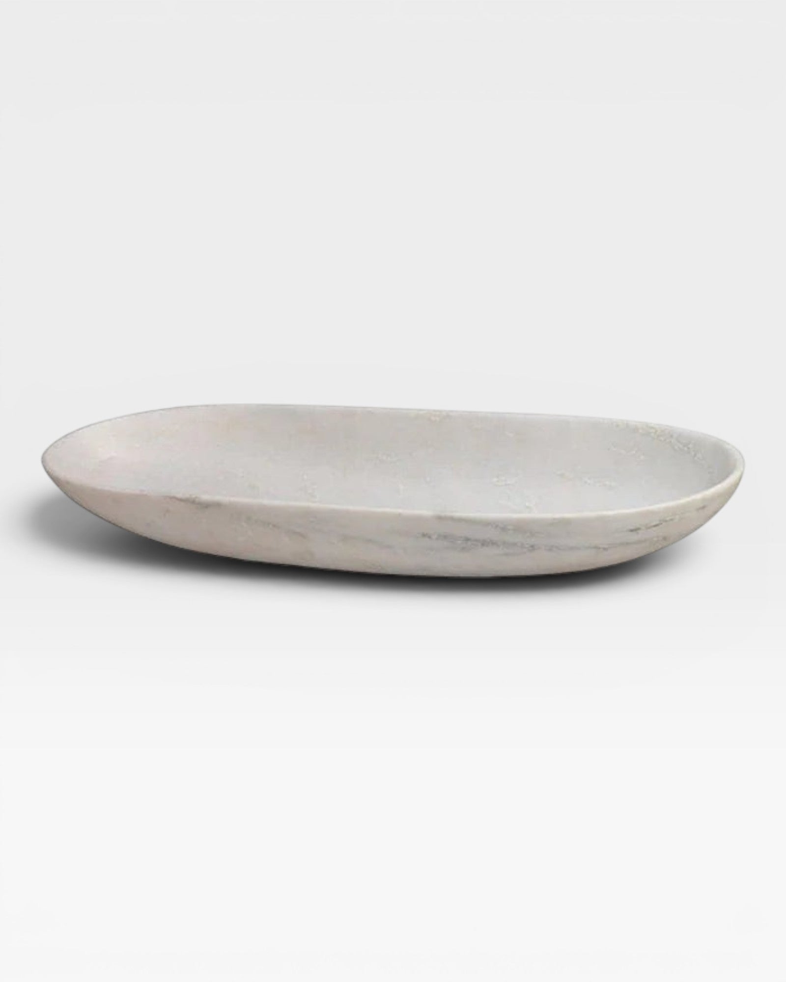 JONES + CO long oval bowl crafted from natural white marble with unique grey veining and a smooth honed finish.