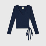 JONES + CO Margot wrap top in midnight blue ribbed knit with a V-neckline and side tie closure.