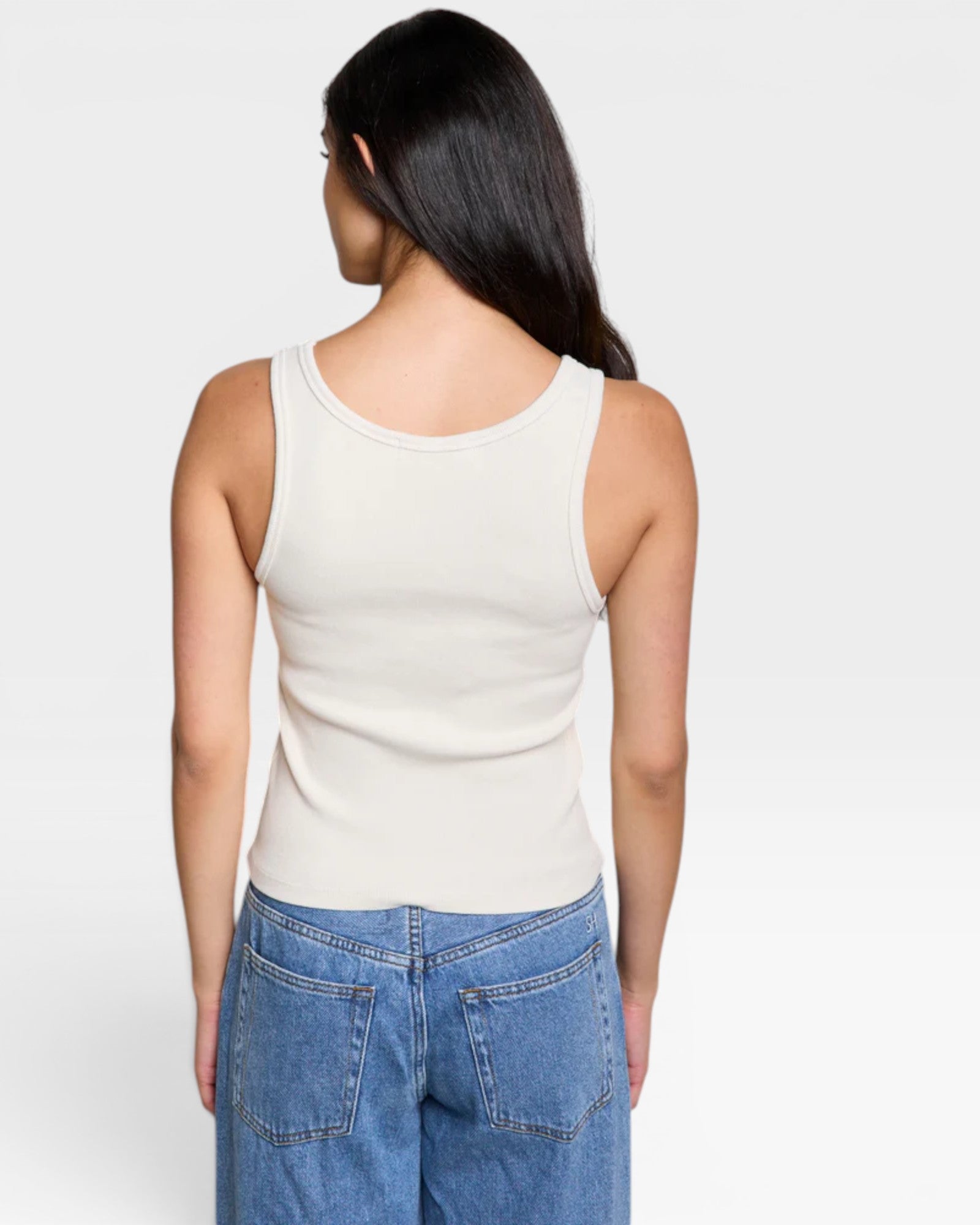 JONES + CO Maria V Neck tank top in sugar white, ribbed fabric, sleeveless design.