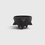 JONES + CO handthrown matte black ceramic Spike Bowl with sculptural spikes and three tapered feet