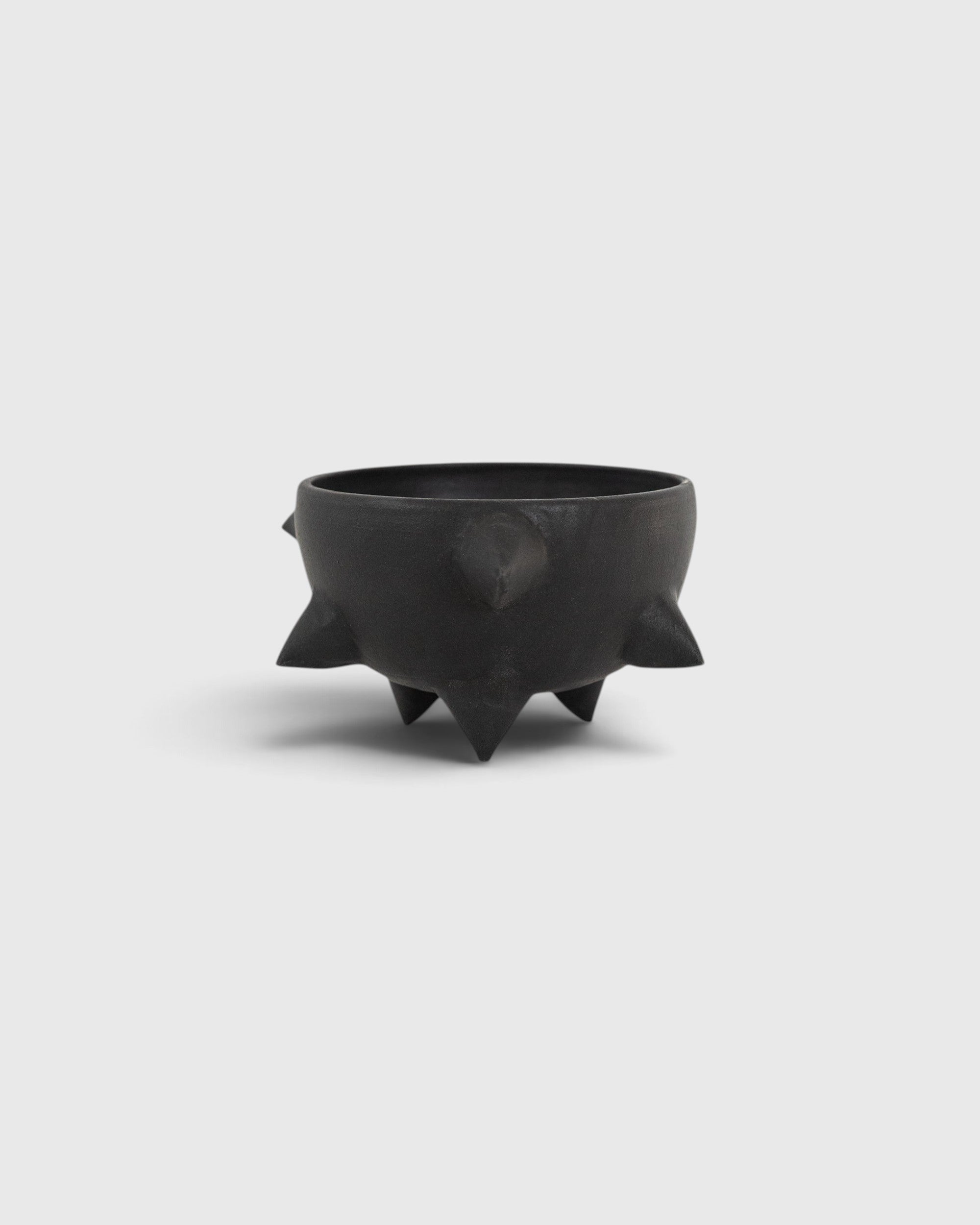 JONES + CO handthrown matte black ceramic Spike Bowl with sculptural spikes and three tapered feet