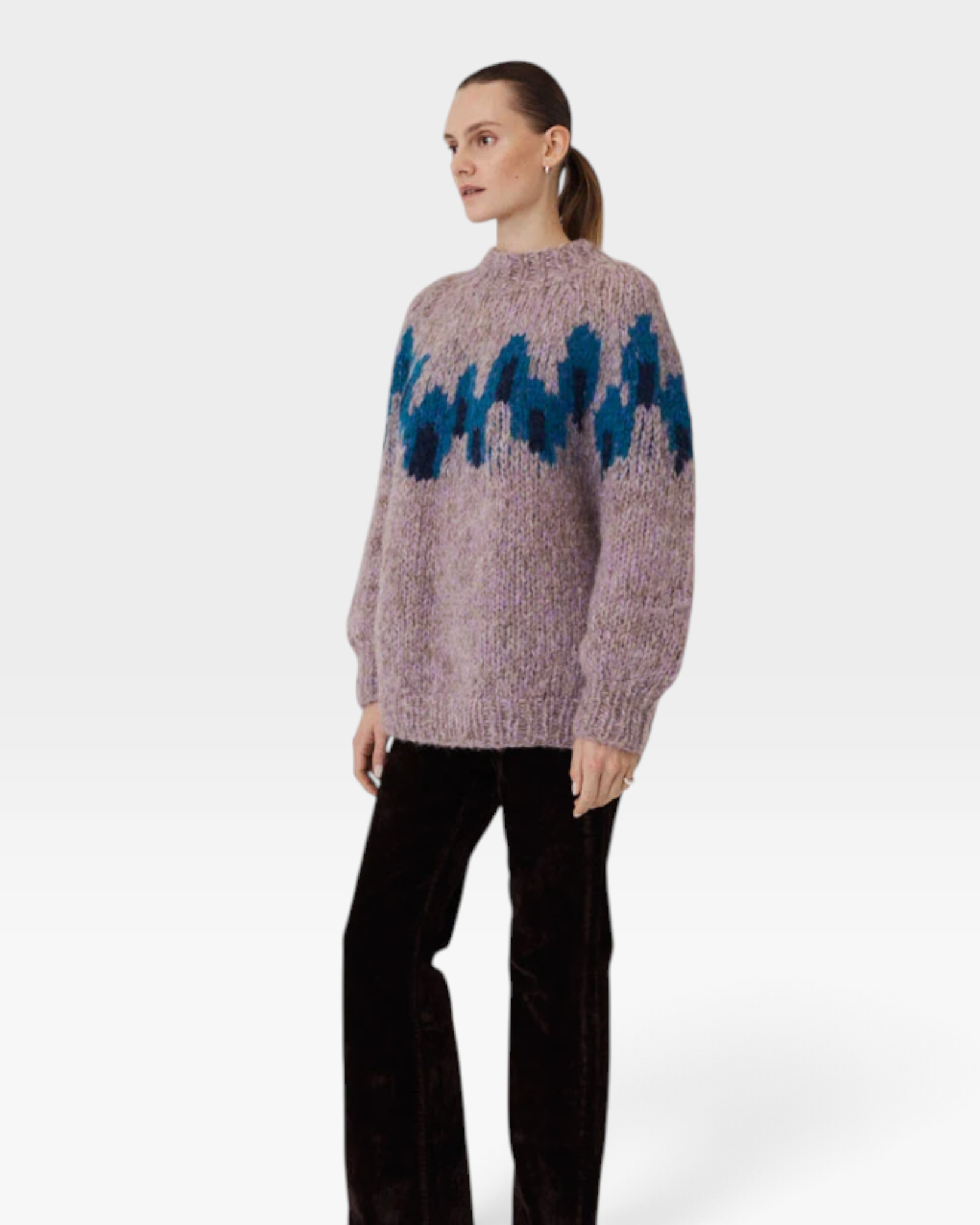 JONES + CO fleecy alpaca raglan pullover in lilac with a blue graphic intarsia pattern worn by a model