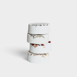 JONES + CO menthol eucalyptus shower steamer stack with dried botanical petals on a white background