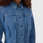 JONES + CO mid-blue denim shirt with pointed collar, button-front closure, and distinctive curved seaming details.