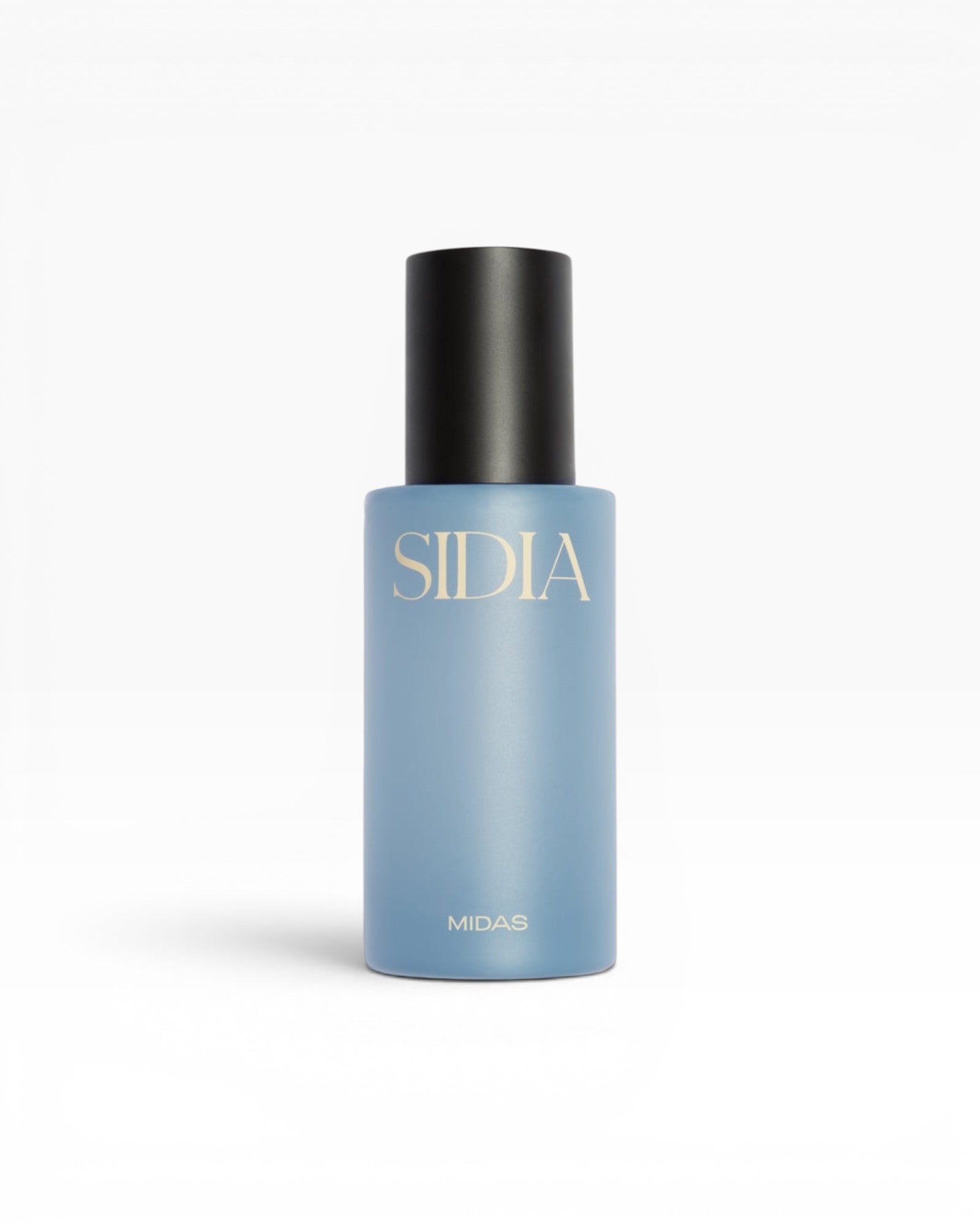 JONES + CO MIDAS Body Mist in a light blue bottle with a black cap, featuring gold lettering.
