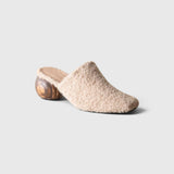 JONES + CO Mina Mule in oatmeal alpaca wool with a sculpted round wooden heel, side view.