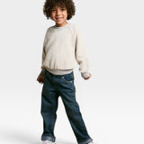 JONES + CO Mini Ziggy sweatshirt in heather grey soft cotton fleece worn by a child with curly hair