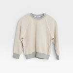 JONES + CO Mini Ziggy sweatshirt in heather grey soft cotton fleece with an inside-out heritage design.