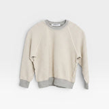 JONES + CO Mini Ziggy sweatshirt in heather grey soft cotton fleece with an inside-out heritage design.