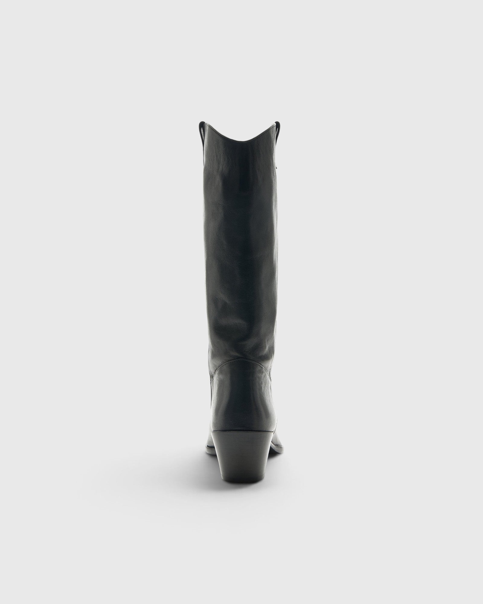 JONES + CO Monty black leather knee-high boot with curved shaft, pull tabs, and angled block heel, back view.