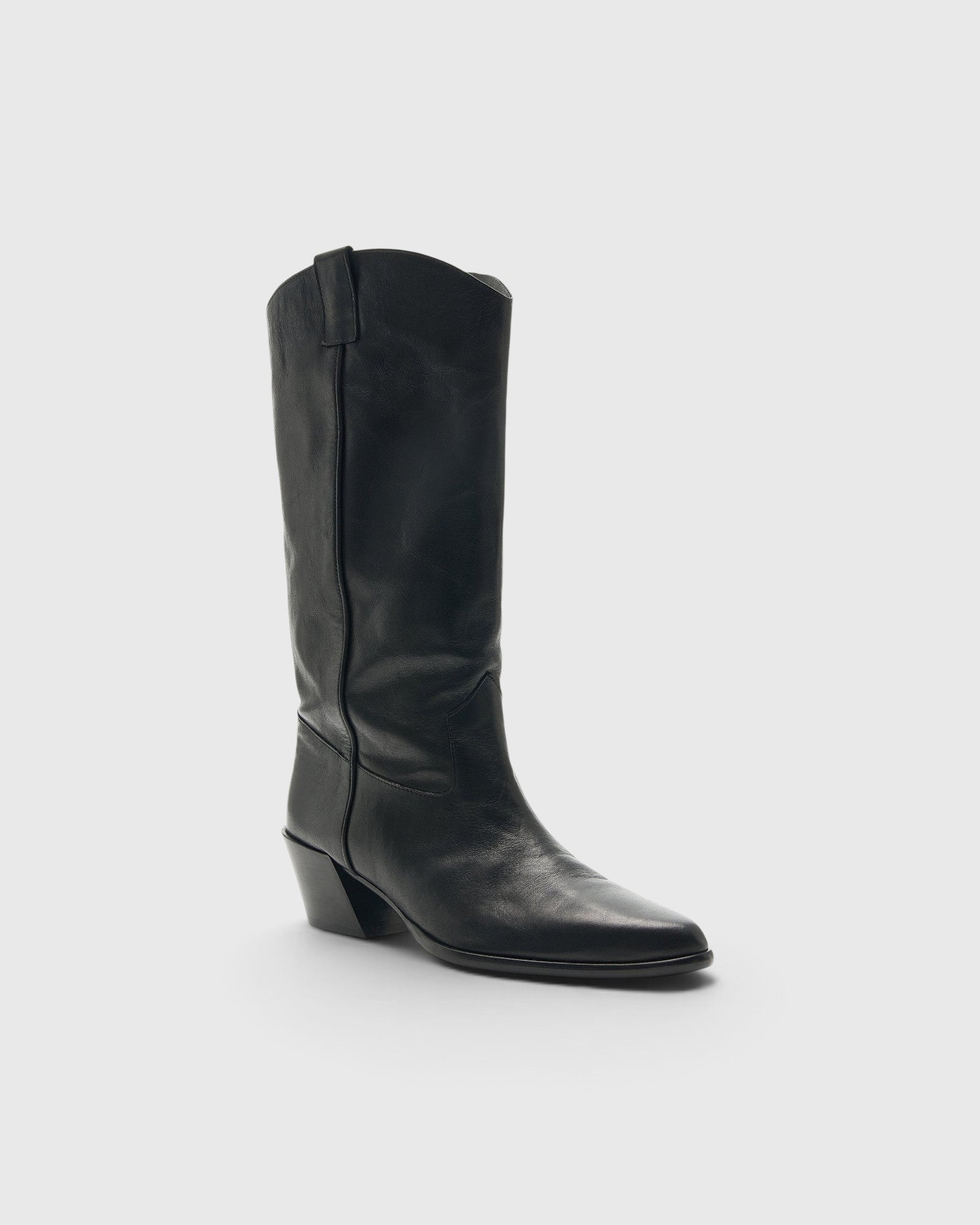 JONES + CO Monty black leather knee-high boot with a curved shaft, pull tabs, pointed toe, and angled block heel.