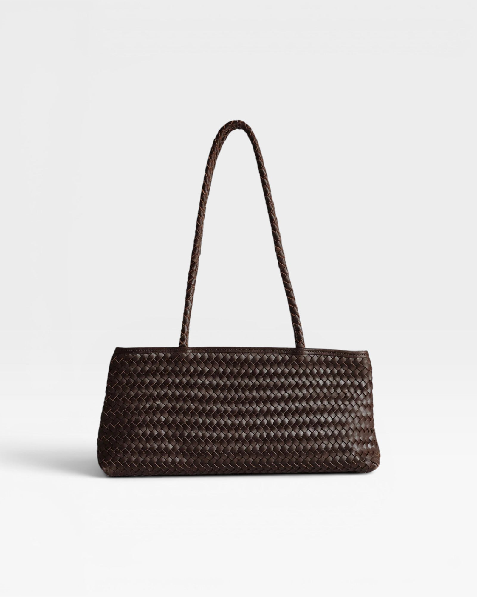 JONES + CO Naomi Bag in espresso brown handwoven leather with braided straps and zip closure.