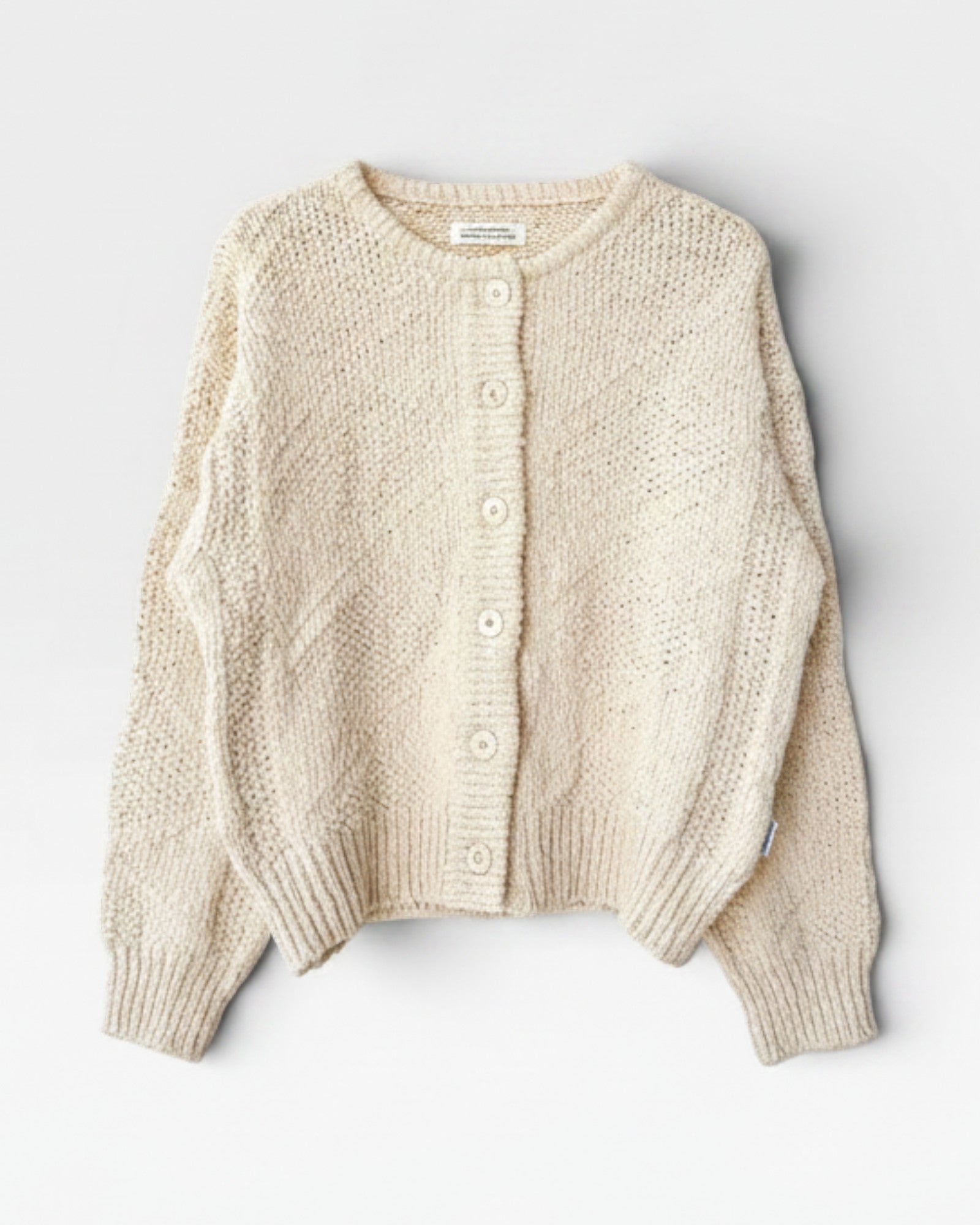 JONES + CO natural cotton slub knit cardigan with button front and relaxed sleeves.