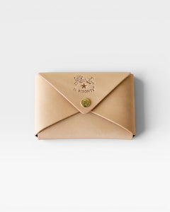 JONES + CO natural vegetable-tanned cowhide Sovana card case with envelope closure and brass snap button.