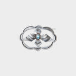 JONES + CO Vintage Navajo Thunderbird brooch in sterling silver with turquoise accent. Oval shape with detailed wings and feathers.