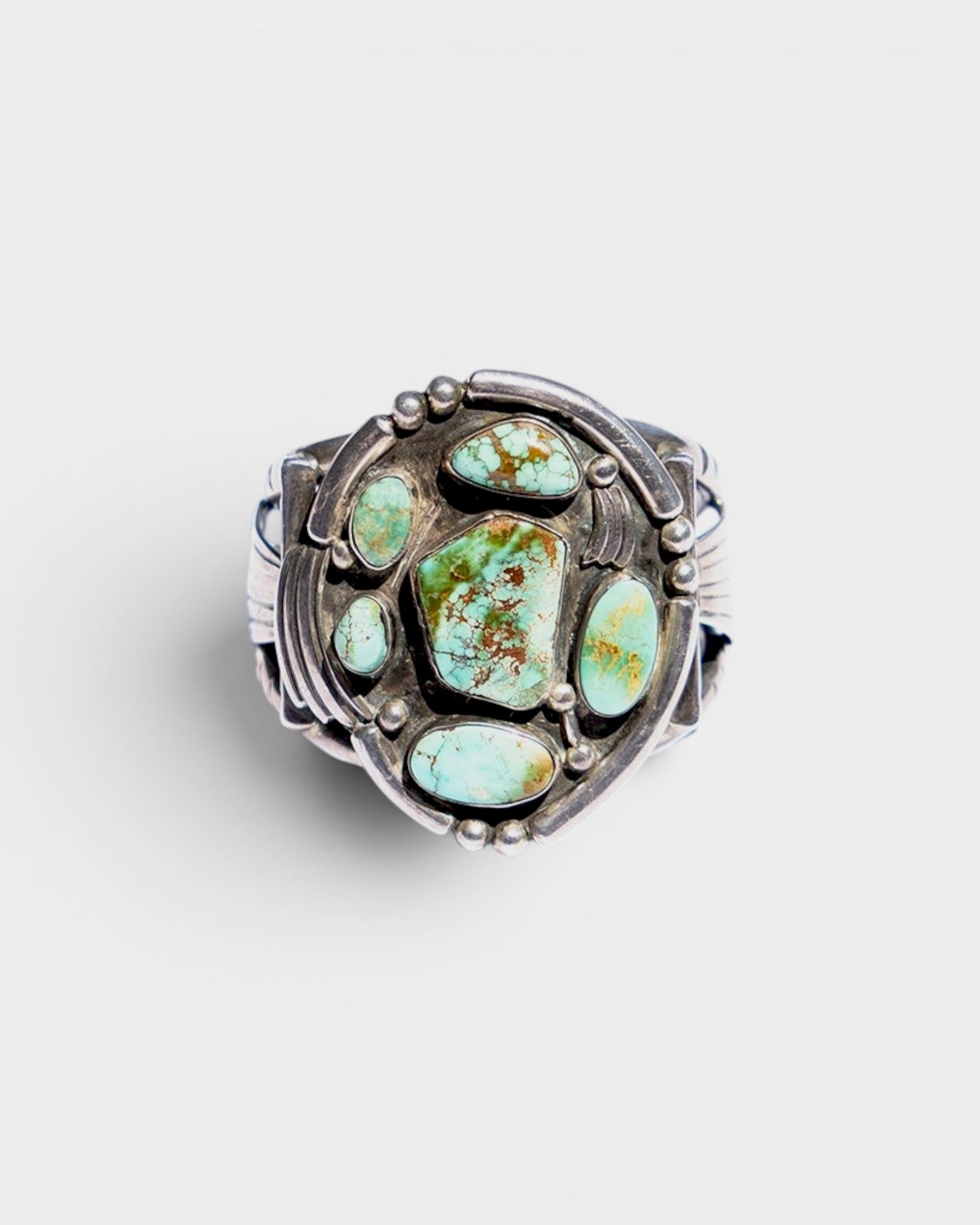 JONES + CO Navajo vintage sterling silver cuff bracelet with multiple green turquoise stones.
