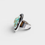 JONES + CO Vintage Navajo oval turquoise ring in sterling silver with unique matrix patterns.