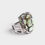 JONES + CO Navajo vintage sterling silver cuff bracelet with multiple green turquoise stones.