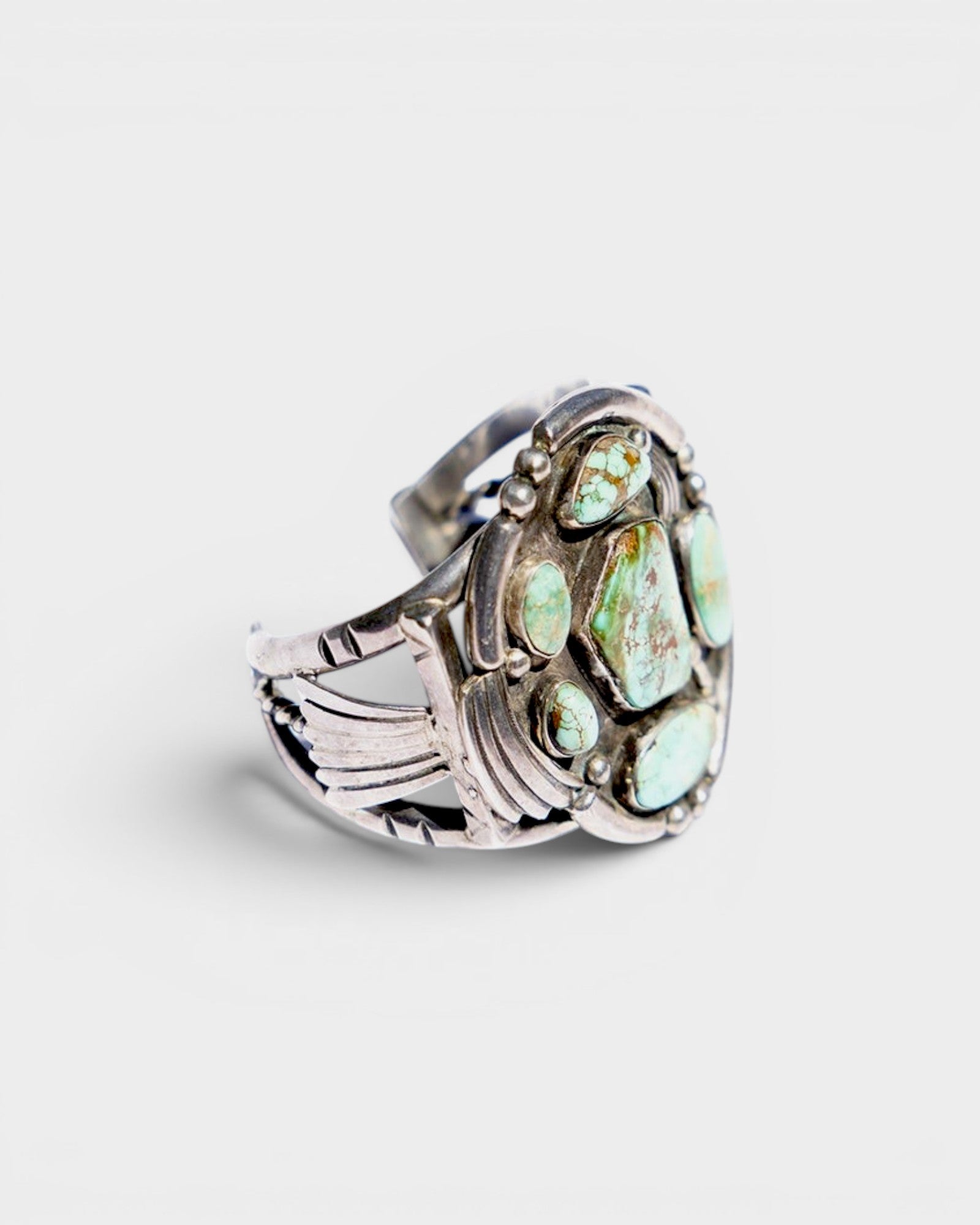 JONES + CO Navajo vintage sterling silver cuff bracelet with multiple green turquoise stones.
