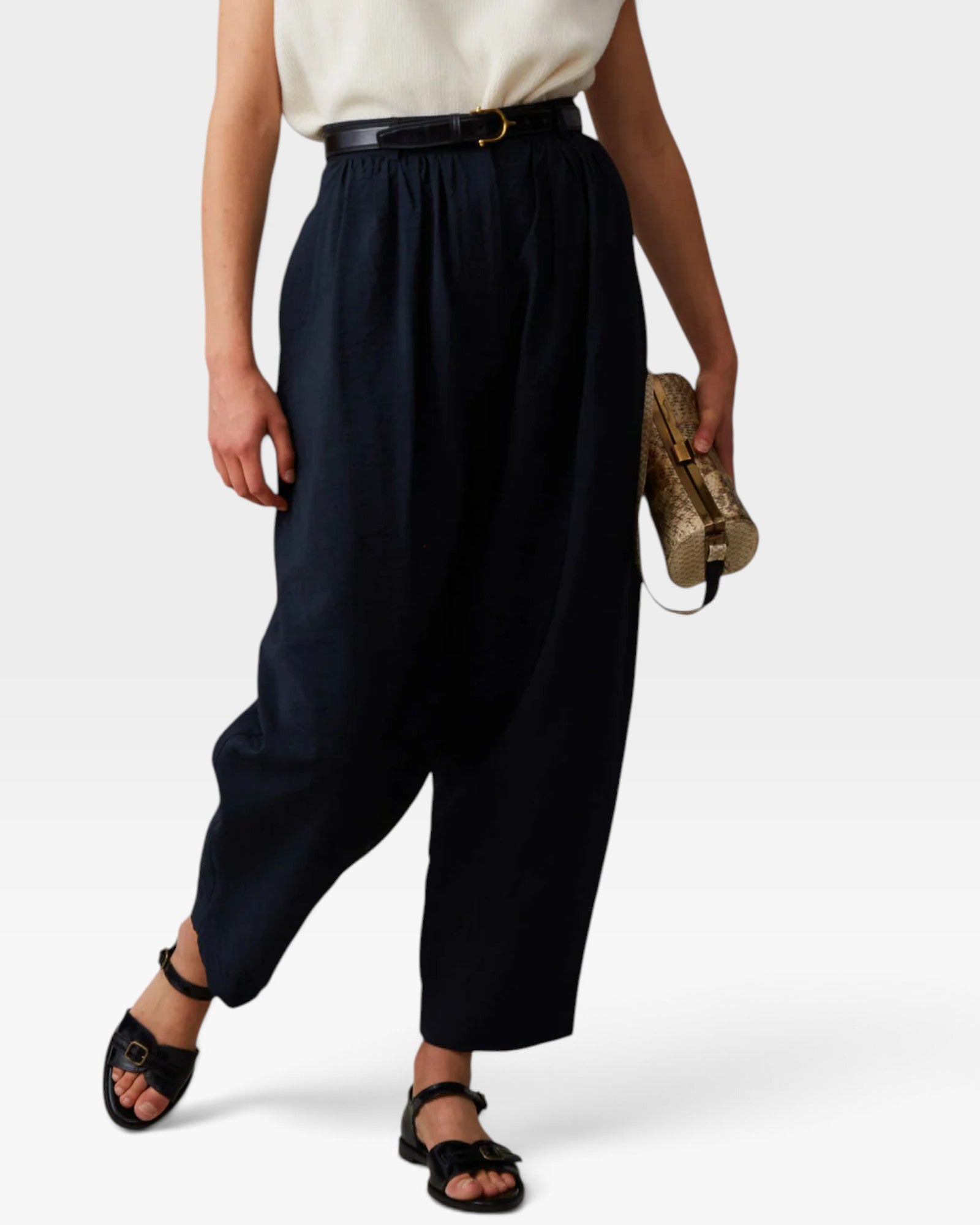JONES + CO navy Brady trousers with a high-waisted gathered fit, tapered cropped leg, and belt loops.