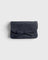 JONES + CO navy blue pebbled leather petite case with a decorative knotted bow and hidden magnetic closure