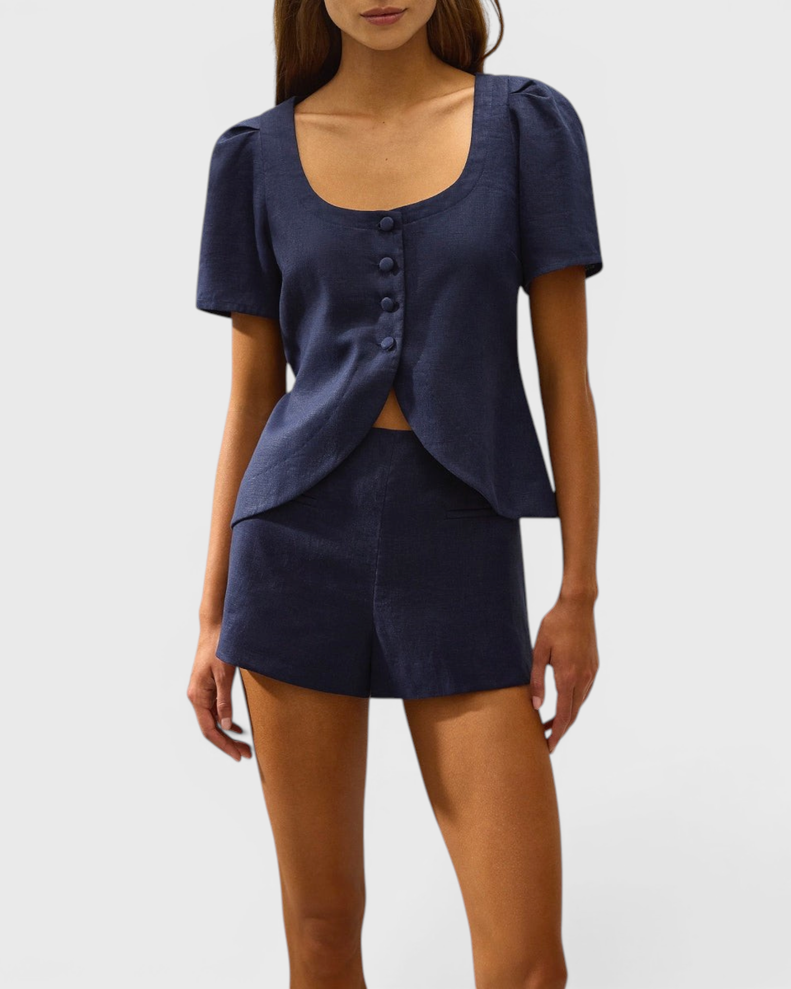 JONES + CO navy linen vest with scoop neckline, button front, and cap sleeves worn with matching shorts