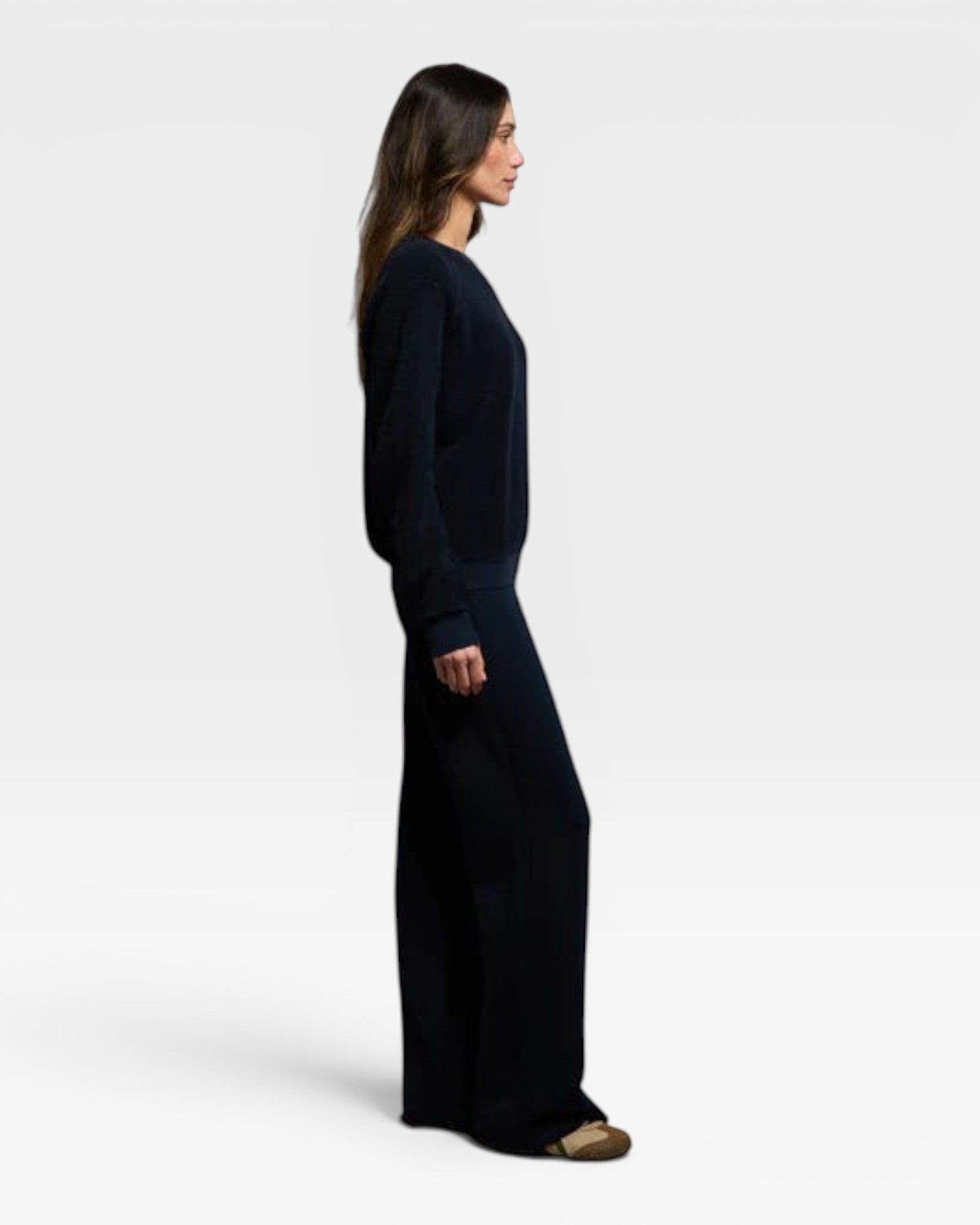 JONES + CO Ziggy sweatshirt in navy worn by a model in a side profile view with matching wide-leg trousers