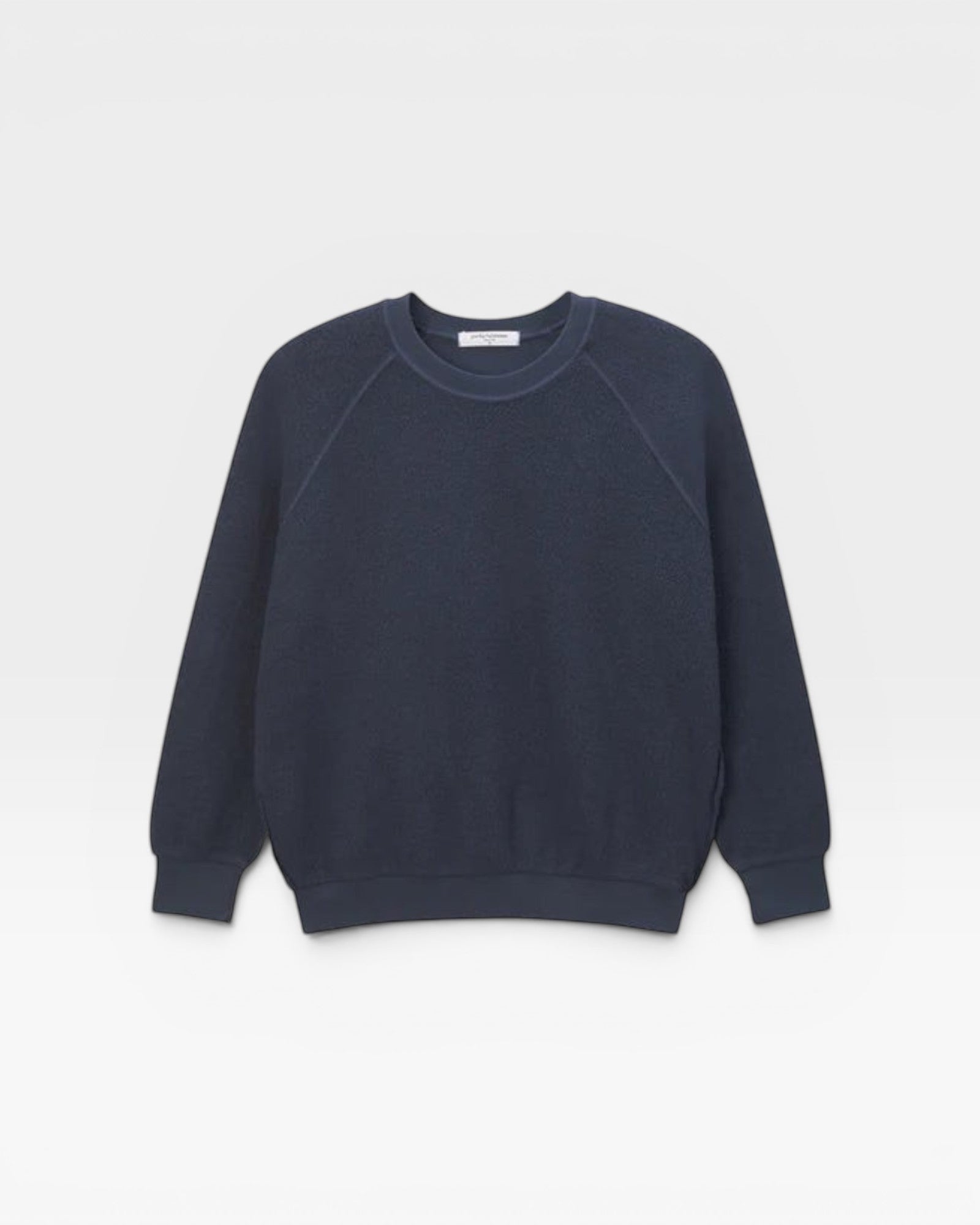 JONES + CO navy blue Ziggy sweatshirt with a classic crew neck and raglan sleeves in a soft textured fabric.