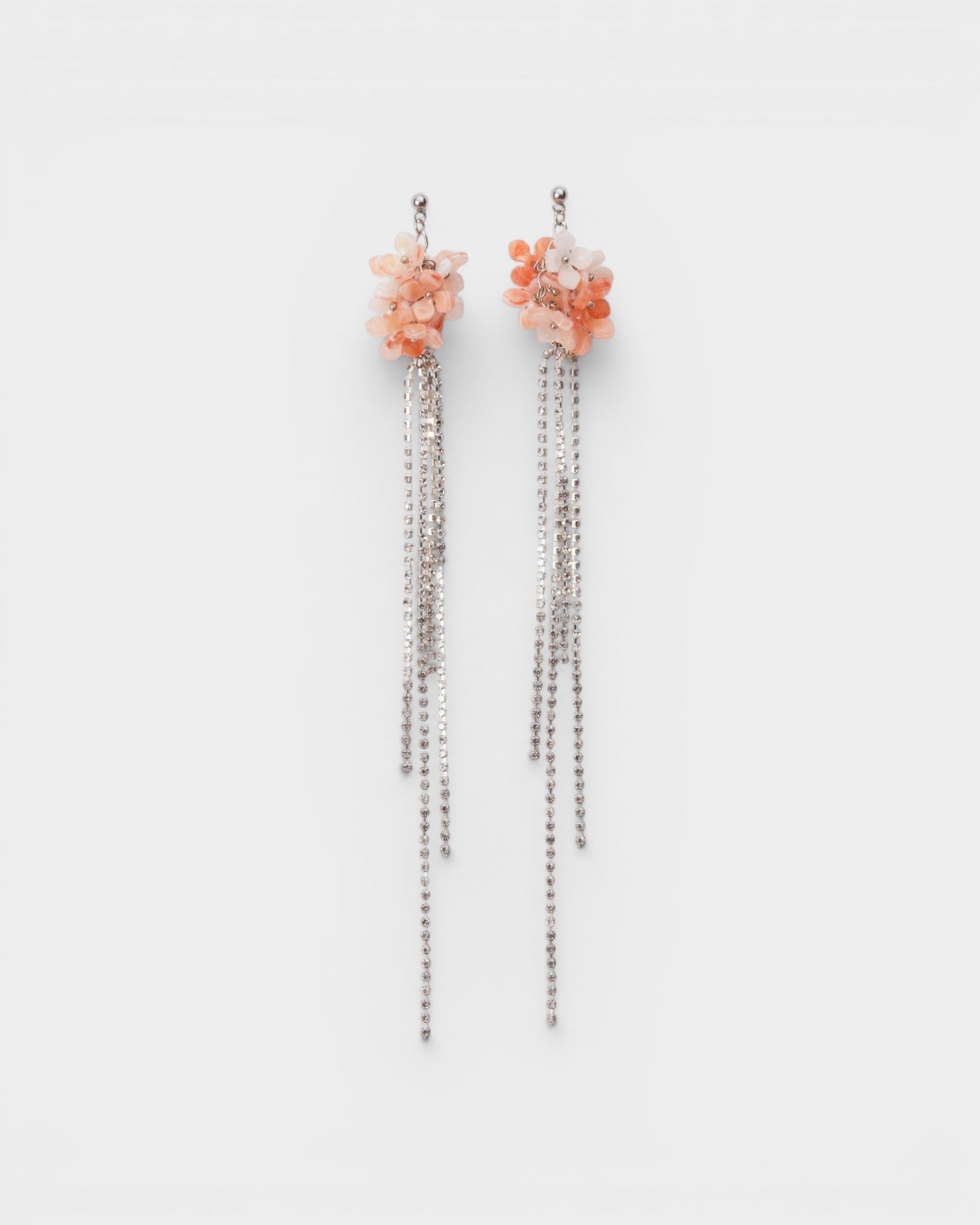 JONES + CO Nerium earrings featuring pink floral clusters and long, dangling silver crystal fringe chains.