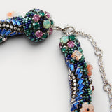 JONES + CO Nerium Necklace with rhinestones, seed beads, floral beads in tubular roll shape, mixed-bead detailing, and adjustable chain.