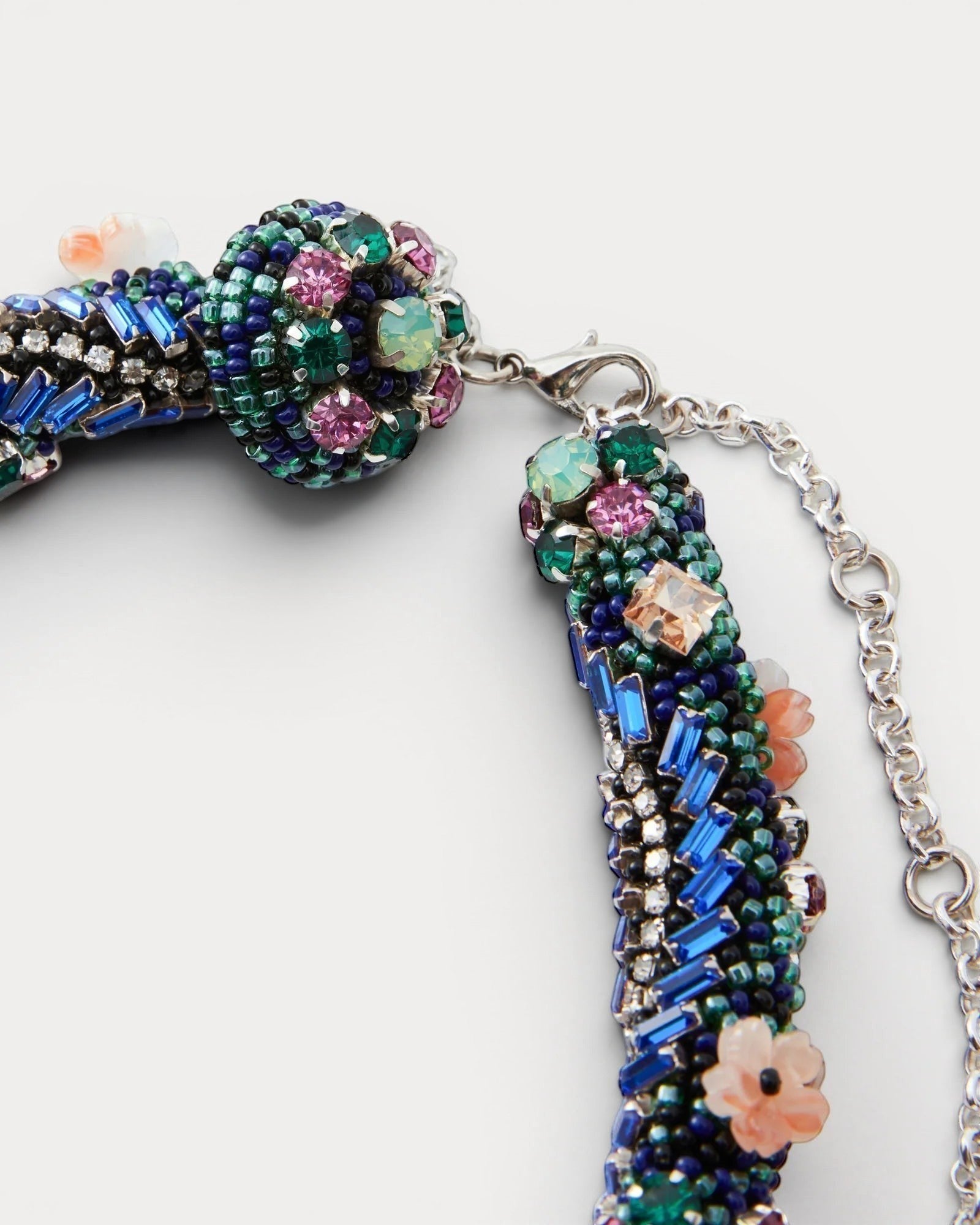 JONES + CO Nerium Necklace with rhinestones, seed beads, floral beads in tubular roll shape, mixed-bead detailing, and adjustable chain.
