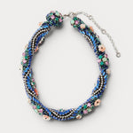 JONES + CO Nerium Necklace: tubular roll shape with blue, green, pink beads, rhinestones, and floral details. Adjustable chain.