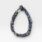 JONES + CO Nerium Necklace with rhinestones, seed beads, floral beads, and adjustable chain. Multi-colored.