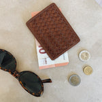 JONES + CO Nico Card Case in sienna brown handwoven leather with two card slots and bill pocket. Includes euro bills and coins.