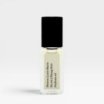 JONES + CO No.03 L'Etang Noir Perfume Oil travel size glass bottle with black cap and cream label.