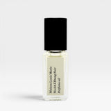 JONES + CO No.03 L'Etang Noir Perfume Oil travel size glass bottle with black cap and cream label.