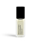 JONES + CO No.03 L'Etang Noir Perfume Oil travel size glass bottle with black cap and cream label.