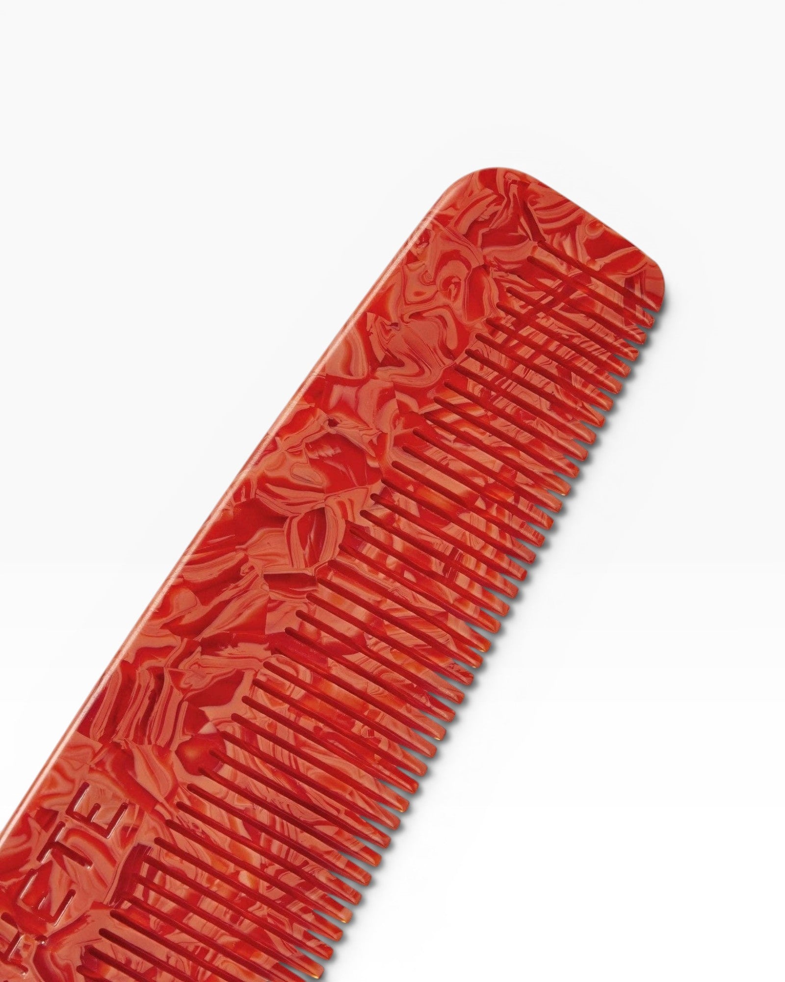 JONES + CO No. 1 Comb in Poppy red marbled acetate, fine-tooth, tapered design for fine hair.