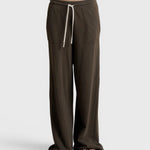 JONES + CO Noa straight-leg french terry pants in dark olive with a rope drawstring waist and deep side pockets.