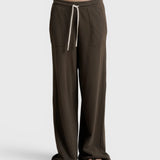 JONES + CO Noa straight-leg french terry pants in dark olive with a rope drawstring waist and deep side pockets.