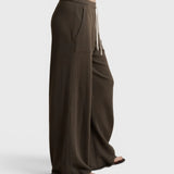 JONES + CO Noa dark olive straight-leg French terry pants with a rope drawstring waist and side pockets, side view