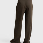 JONES + CO Noa straight-leg french terry pants in dark olive with a drawstring waist, back view.
