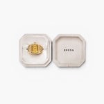 JONES + CO Nocturne Time Ring in 18K gold-plated stainless steel with an amber crystal face in a velvet jewelry box.