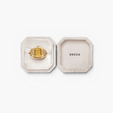 JONES + CO Nocturne Time Ring in 18K gold-plated stainless steel with an amber crystal face in a velvet jewelry box.