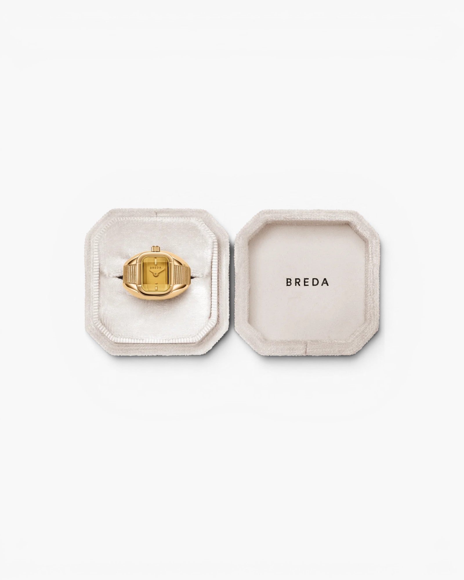 JONES + CO Nocturne Time Ring in 18K gold-plated stainless steel with an amber crystal face in a velvet jewelry box.