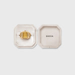 JONES + CO Nocturne Time Ring in 18K gold-plated stainless steel with an amber crystal face in a velvet display box.