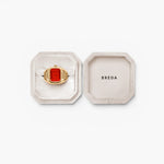 JONES + CO Nocturne Time Ring featuring a deep gold-plated rectangular case and flame-colored crystal in a velvet box