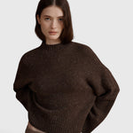 JONES + CO Bettina cashmere sweater in oak brown with mock neck, balloon sleeves, and dropped shoulders on a model