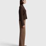 JONES + CO Bettina cashmere sweater in oak brown with mock neck, balloon sleeves, and dropped shoulders, side view.
